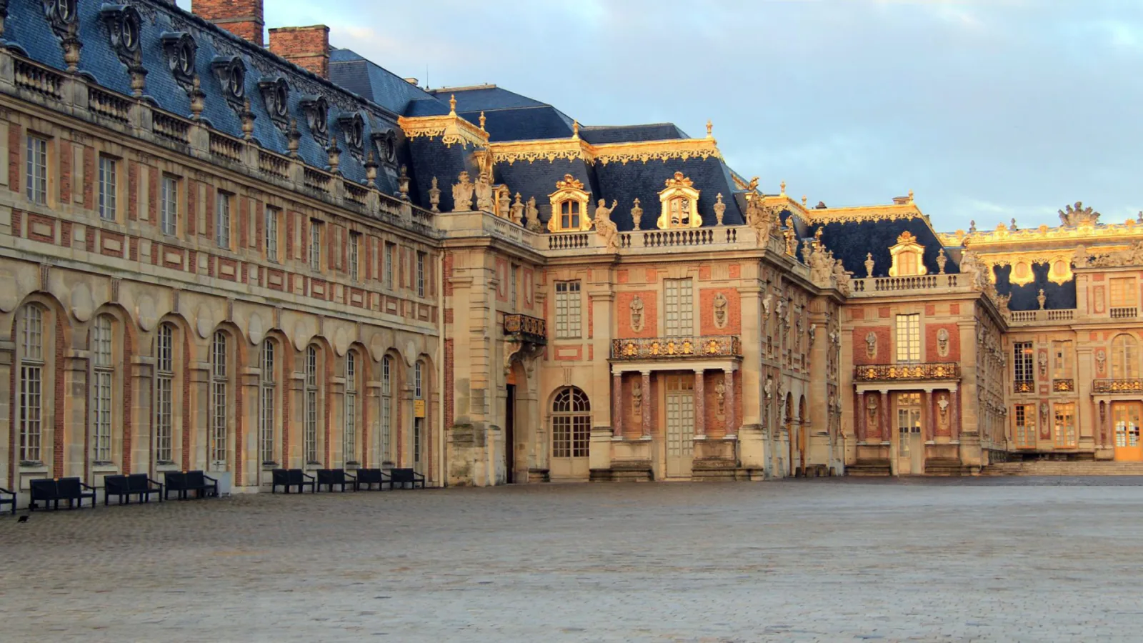 The palace facade in early golden light