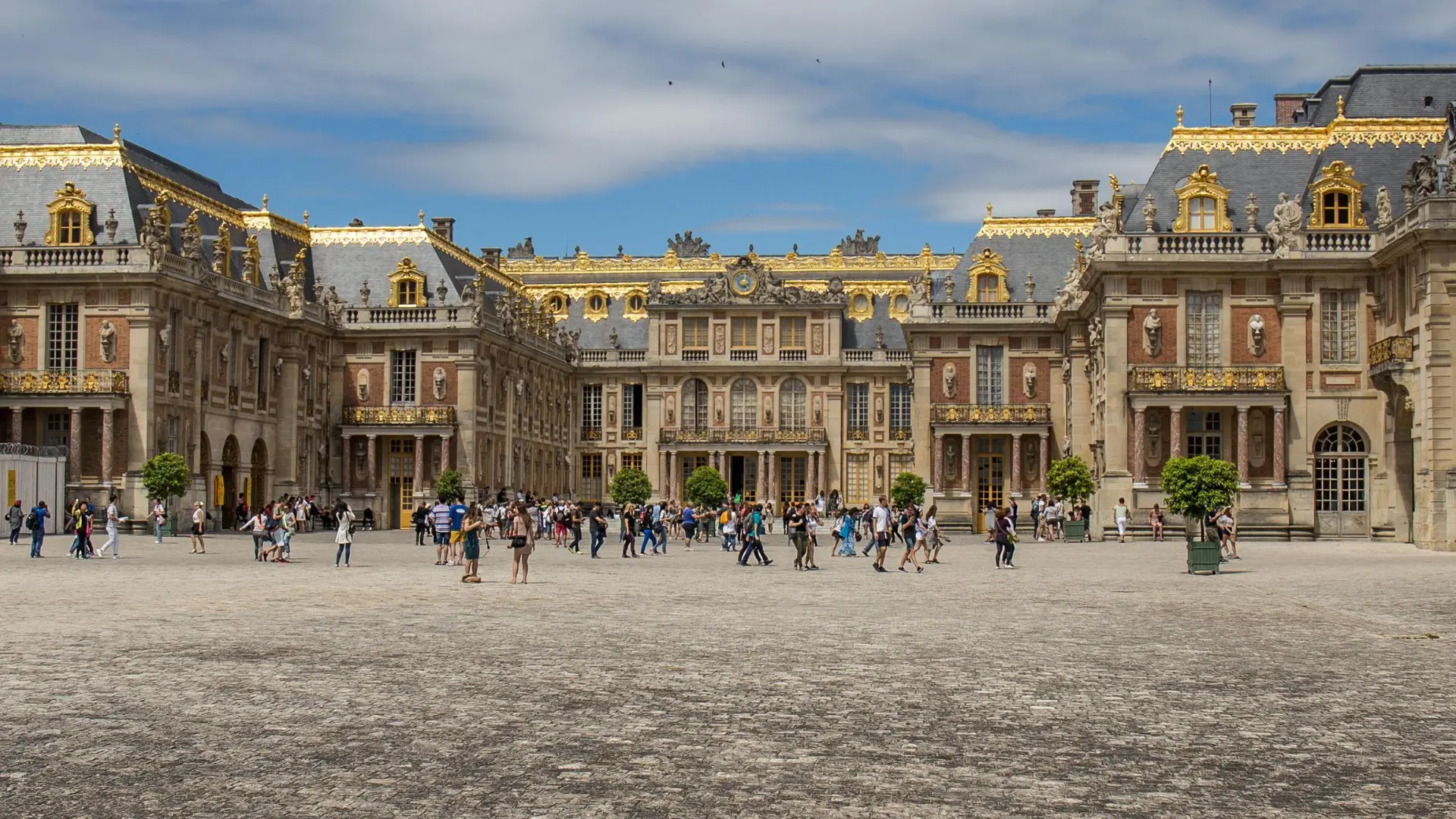 The marble courtyard and gilded roofline