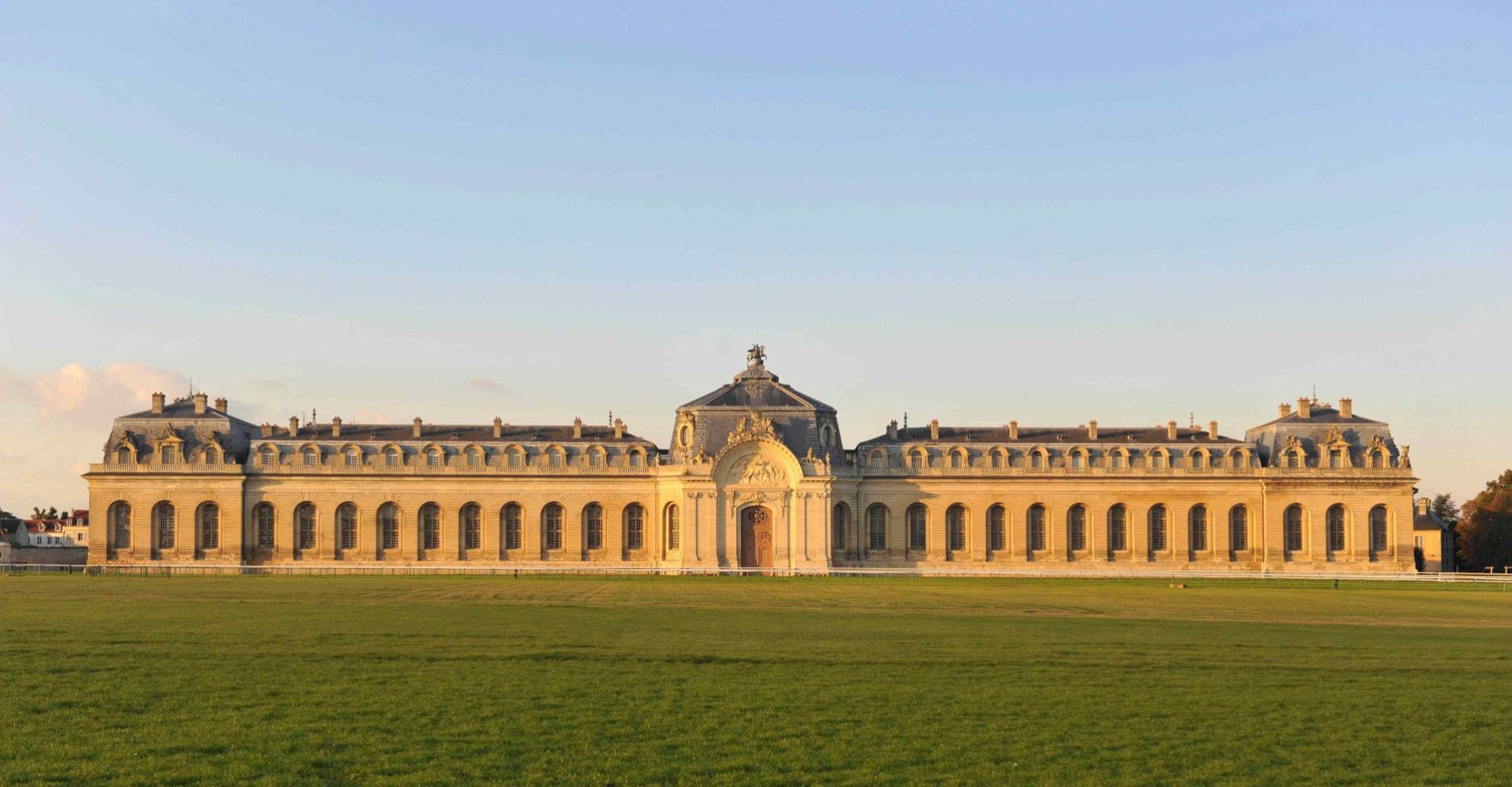 The Great Stables of Chantilly at golden hour